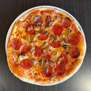 Hot Honey Italian, a Longshot specialty pizza seen from above: spicy Marinara, Mozzarella & Provolone, Pepperoni, Spicy Sausage, Hot Honey Drizzle, on a blistered brick-oven crust