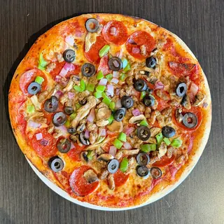 The Longshot Supreme, a Longshot specialty pizza seen from above: house Marinara, Mozzarella & Provolone, Pepperoni, Sausage, Mushroom, Green Pepper, Red Onion, Black Olives, on a blistered brick-oven crust