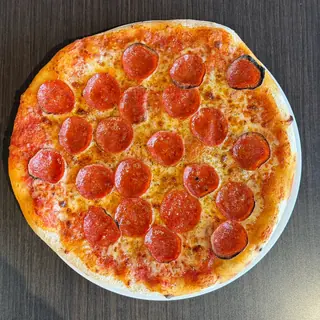 The No Doubter, a Longshot specialty pizza seen from above: house Marinara, Mozzarella & Provolone, Pepperoni, Parmesan, Oregano, on a blistered brick-oven crust